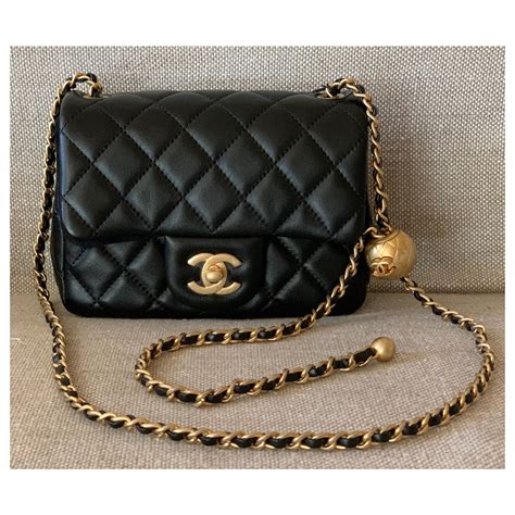 chanel pearl crush flap|Chanel mini flap bag with top handle.